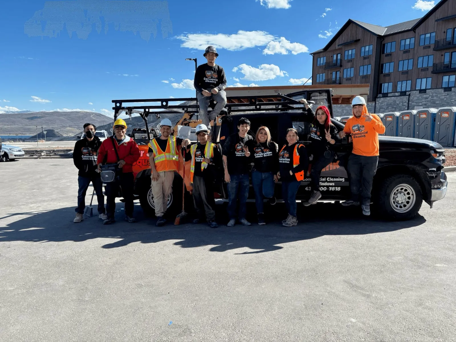 The Junk In Our Trunk workforce and cleaning crew with their truck at a jobsite