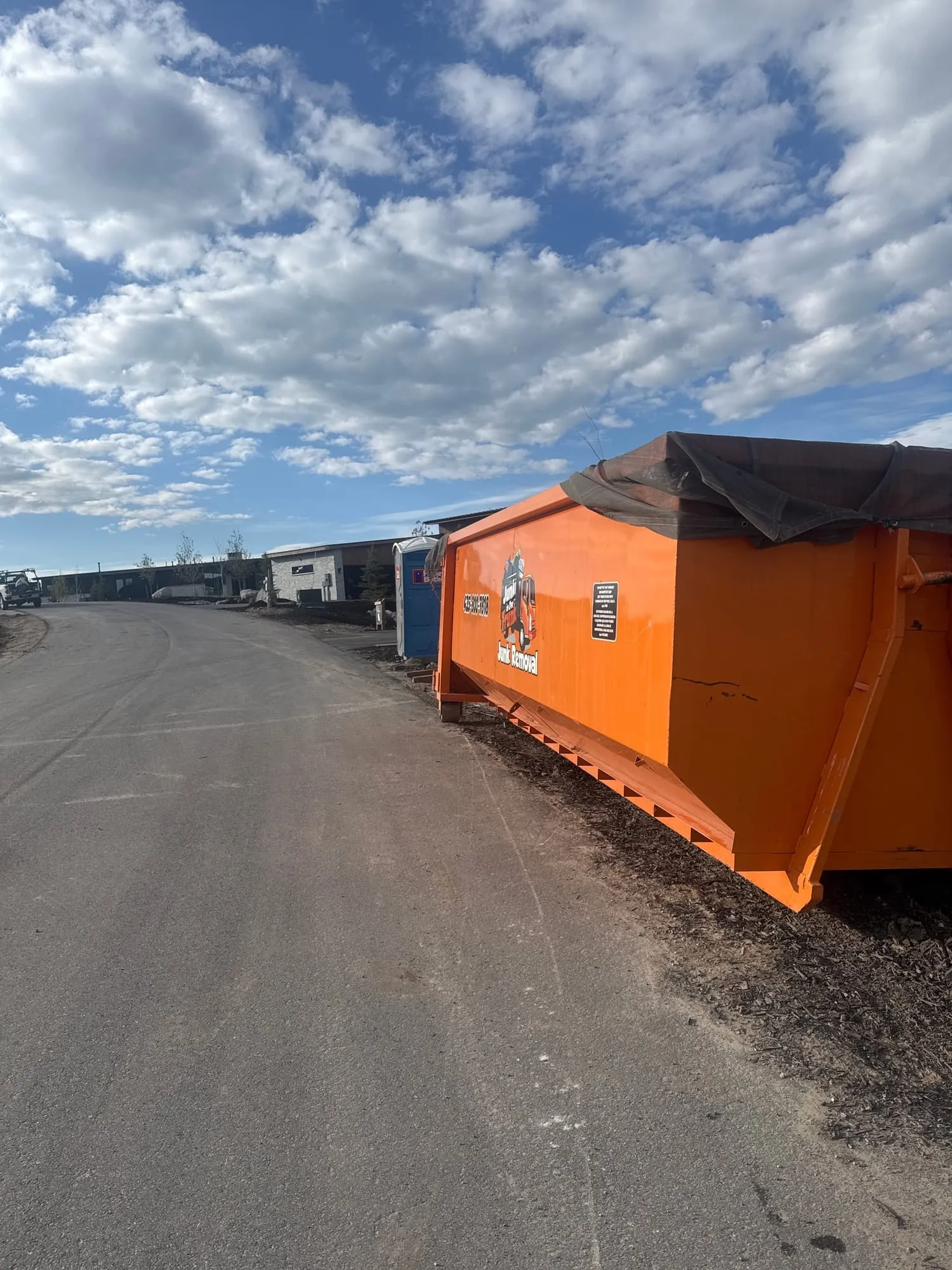 Dumpster along a new subdivision road