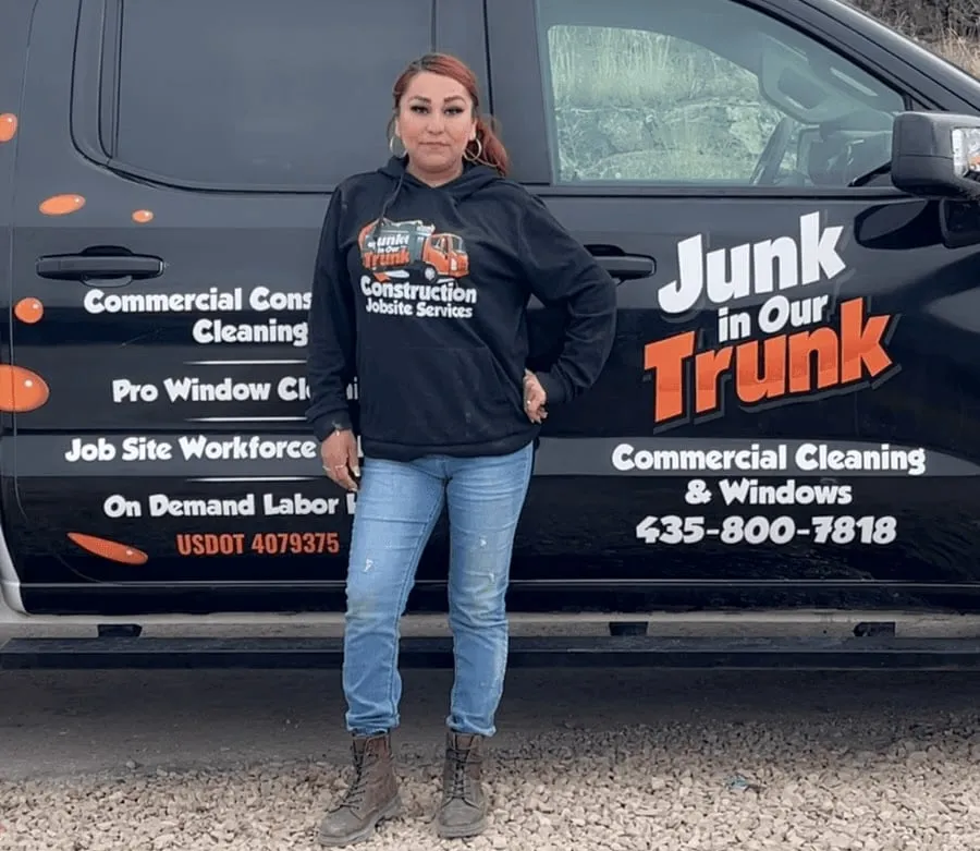 Rita Oros, Director of Cleaning, next to a Junk In Our Trunk truck